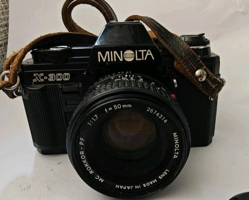 Minolta 300 con objetivo - x-300,